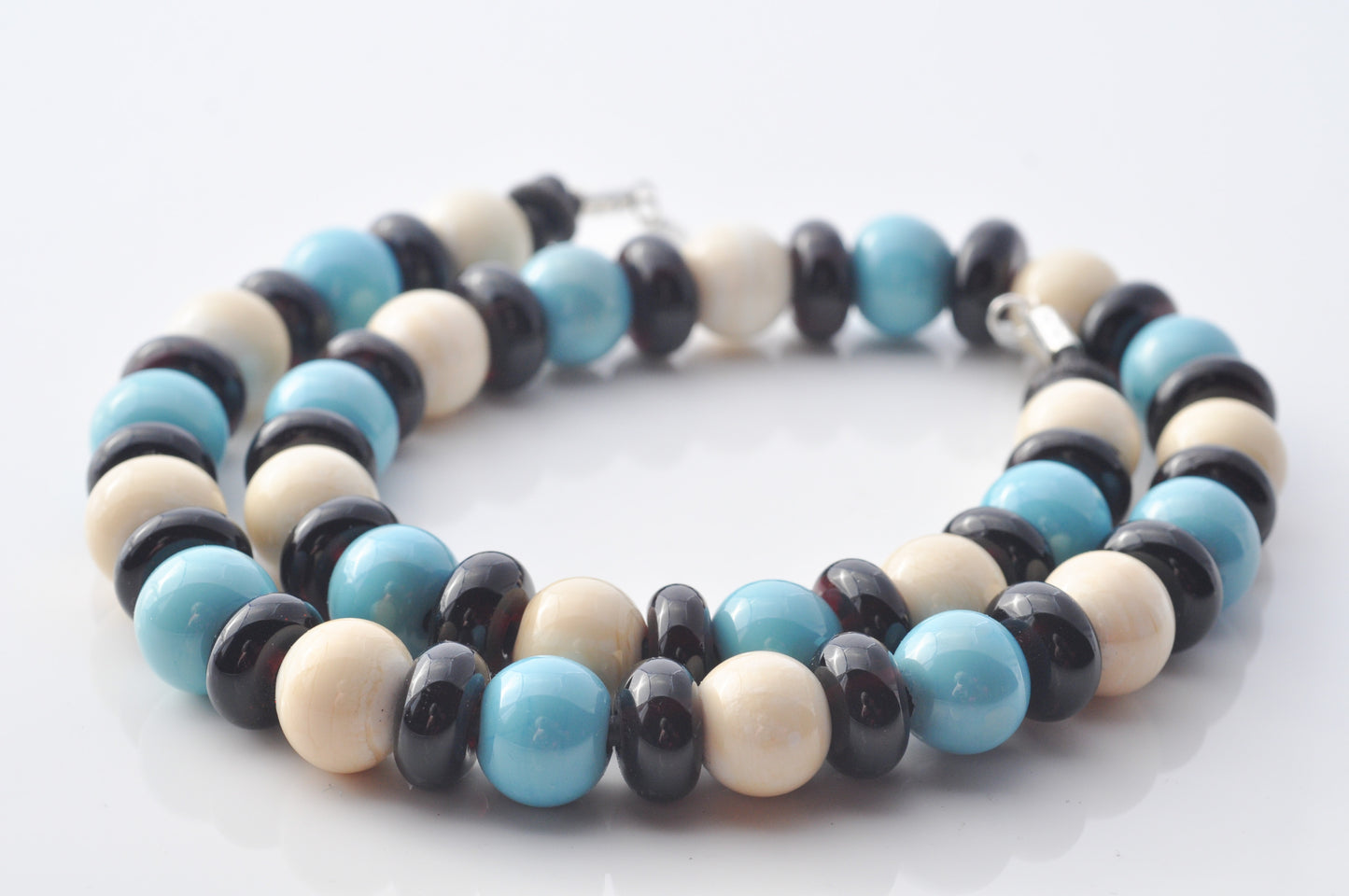 Necklaces: Spheres and donuts