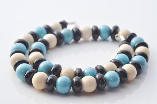 Necklaces: Spheres and donuts